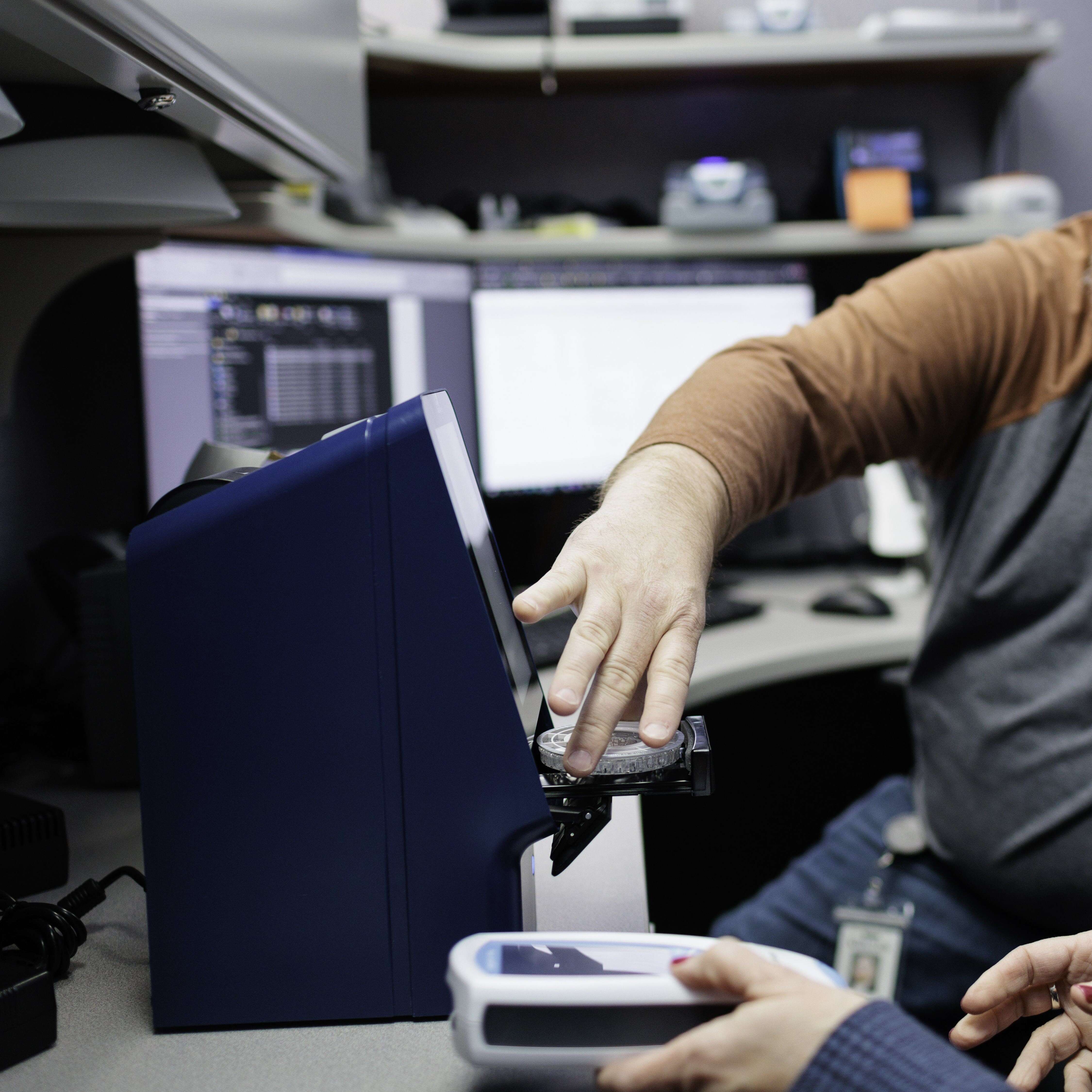 hands working with point of care devices