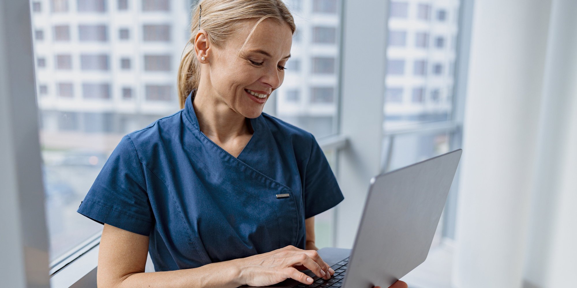 Web Preview Image - Healthcare Worker Using Laptop