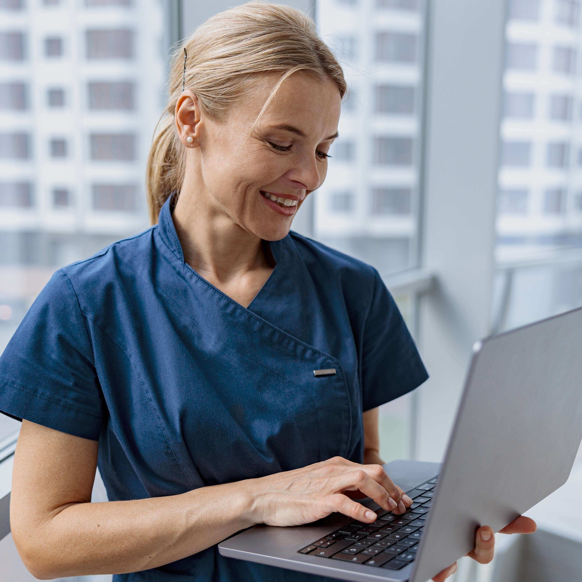 healthcare worker using laptop